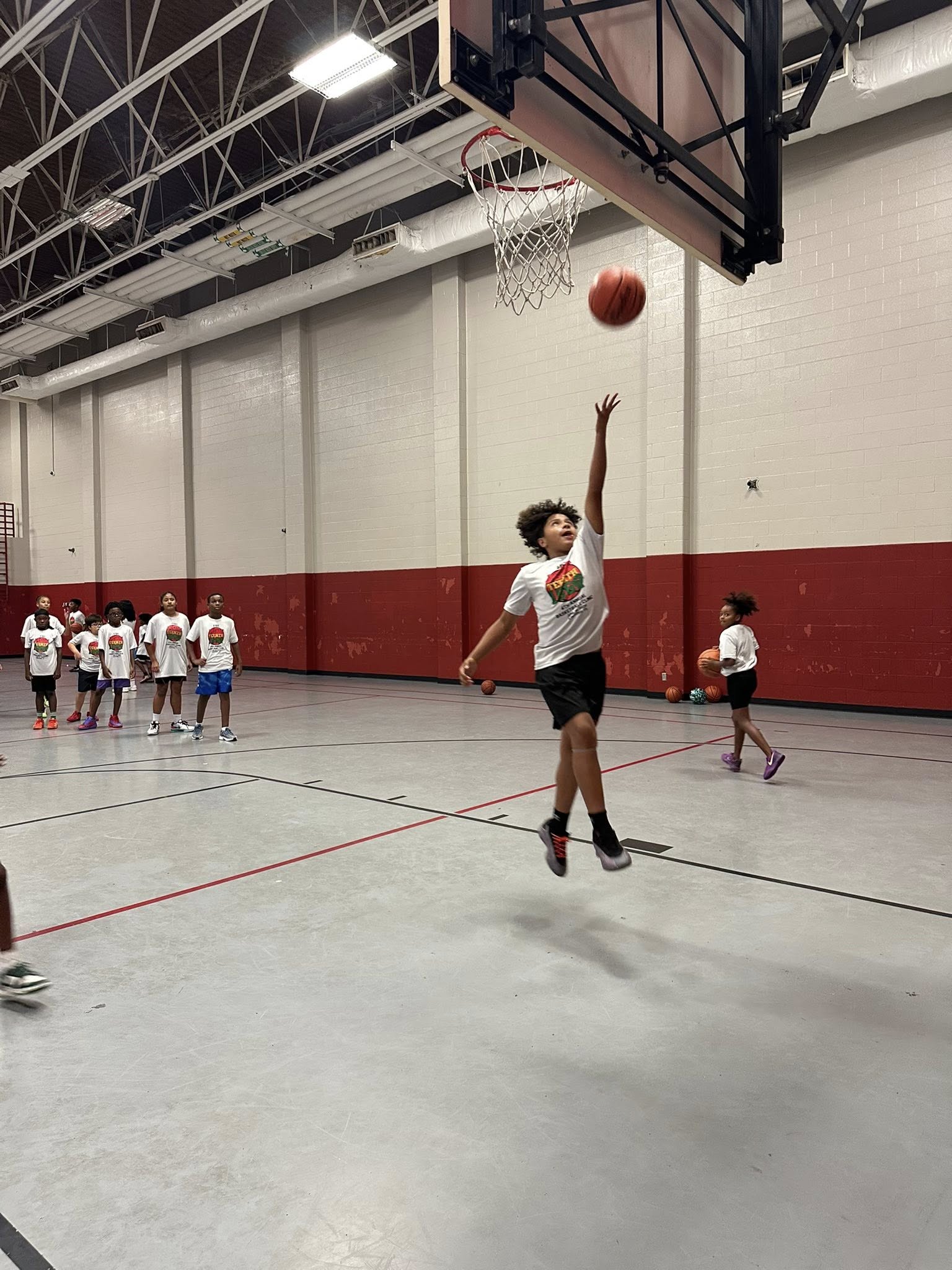 Young SYBA athlete making a layup