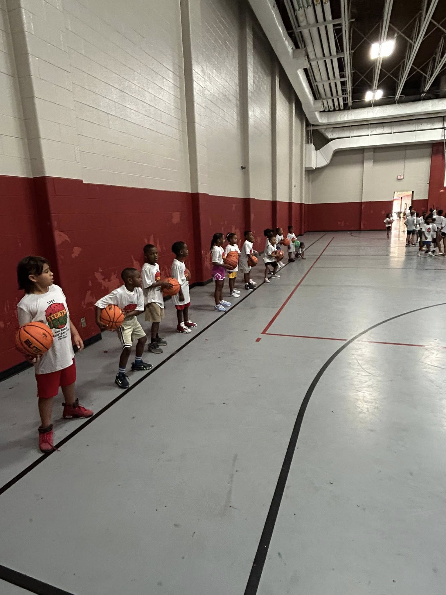 Young players practicing with basketballs